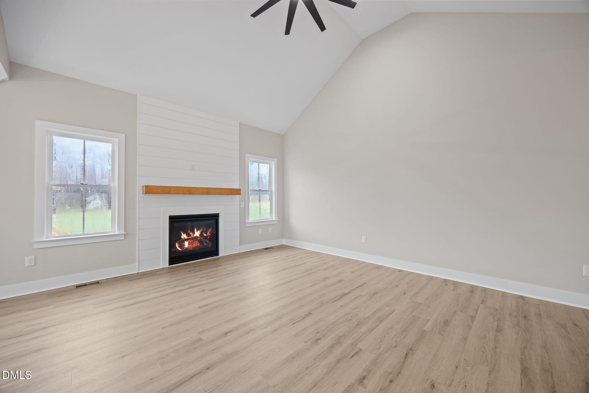 1221 Antioch Church Road Timberlake, NC 27583 - Photo 6 of 45 a view of an empty room with window and fire place