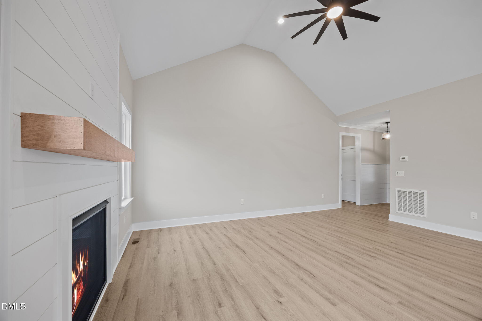 1221 Antioch Church Road Timberlake, NC 27583 - Photo 7 of 45 a view of empty room with wooden floor and fan