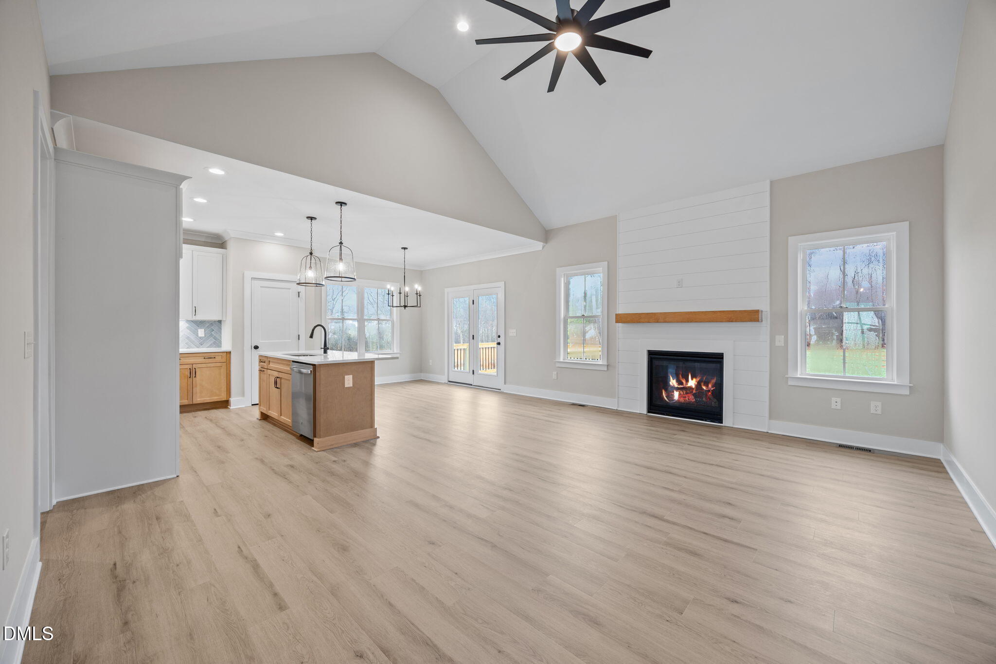 1221 Antioch Church Road Timberlake, NC 27583 - Photo 8 of 45 a view of a room with wooden floor and kitchen view