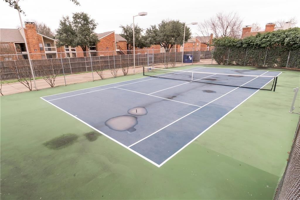 18240 Midway Road, Unit 302 Dallas, TX 75287 - Photo 31 of 33 a view of a tennis court
