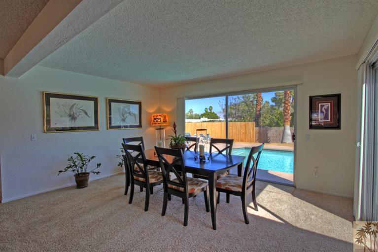 71520 Gardess Road Rancho Mirage, CA 92270 - Photo 11 of 25 a view of a dining room with furniture and a potted plant