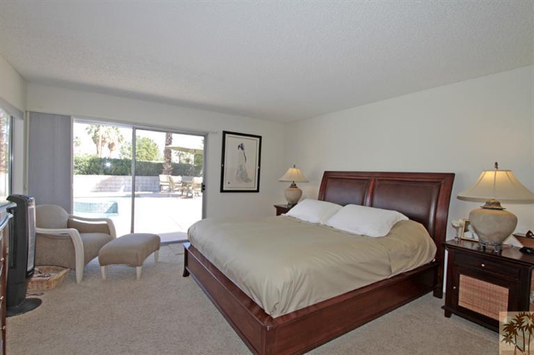 71520 Gardess Road Rancho Mirage, CA 92270 - Photo 16 of 25 a large bedroom with a bed and large windows