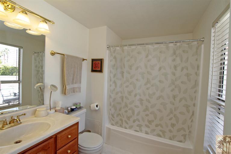 71520 Gardess Road Rancho Mirage, CA 92270 - Photo 18 of 25 a bathroom with a sink toilet and shower