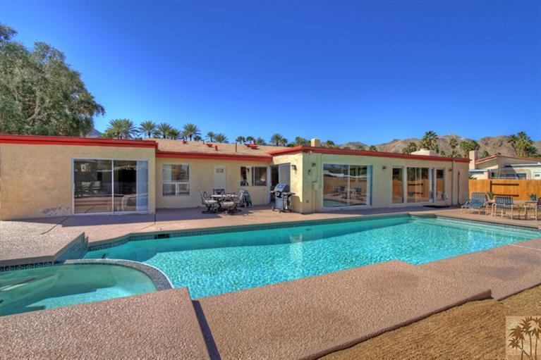 71520 Gardess Road Rancho Mirage, CA 92270 - Photo 24 of 25 a front view of a house with a yard table and chairs