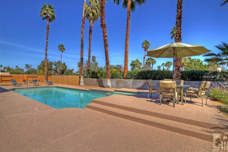 71520 Gardess Road Rancho Mirage, CA 92270 - Photo 25 of 25 a view of a patio with a table and chairs under an umbrella