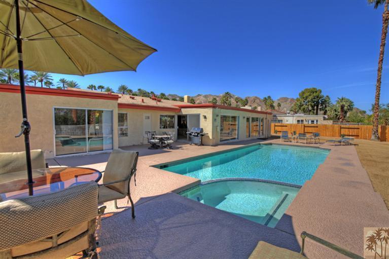 71520 Gardess Road Rancho Mirage, CA 92270 - Photo 3 of 25 a view of a swimming pool with a lounge chairs
