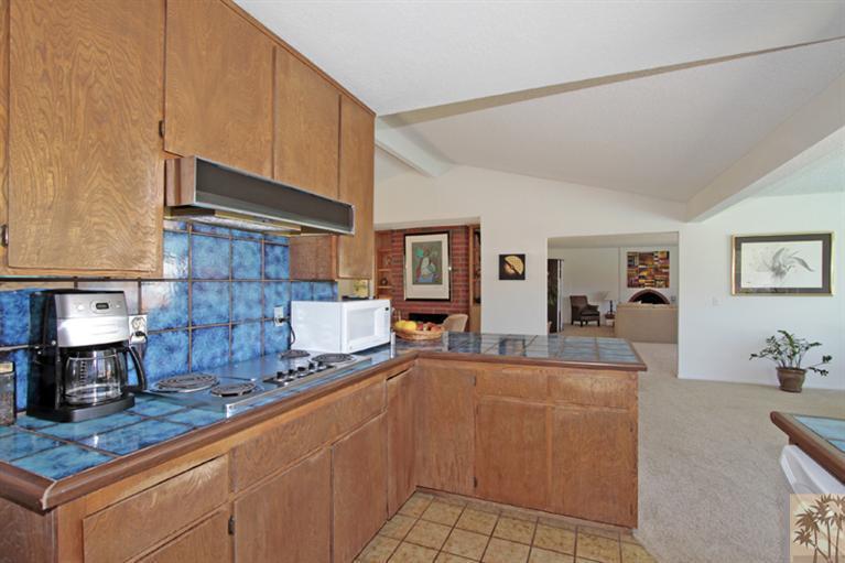 71520 Gardess Road Rancho Mirage, CA 92270 - Photo 8 of 25 a kitchen with stainless steel appliances granite countertop a sink and cabinets