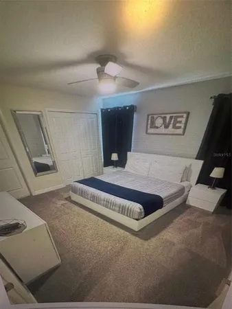 a view of furniture and refrigerator in a room