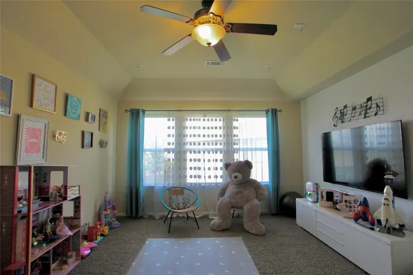 a bed room with a bed and a window