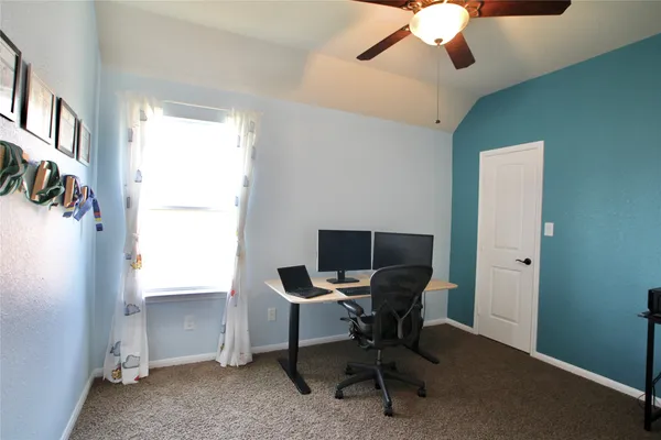 a bathroom with a shower and a sink