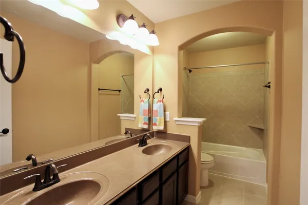 a view of a swimming pool with a patio and swimming pool