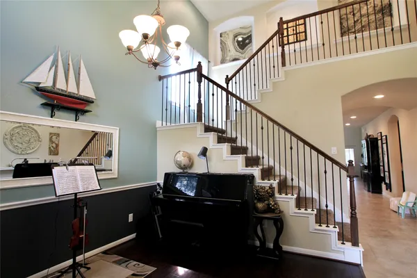 a kitchen with kitchen island granite countertop stainless steel appliances a sink stove and refrigerator