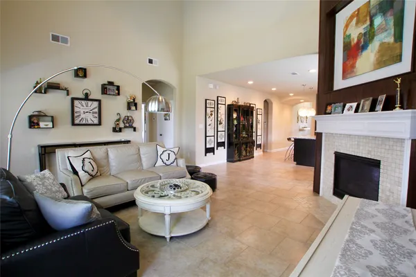 a living room with furniture fireplace and flat screen tv