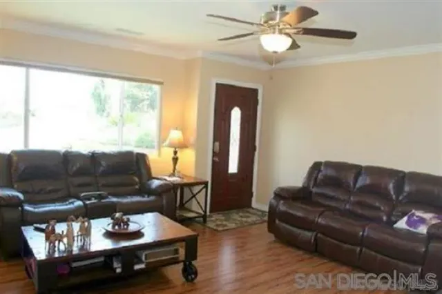 a living room with furniture and a window