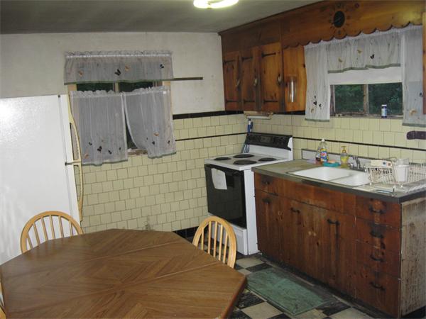 89 Juniper Road Holbrook, MA 02343 - Photo 3 of 7 a kitchen with a sink cabinets and appliances