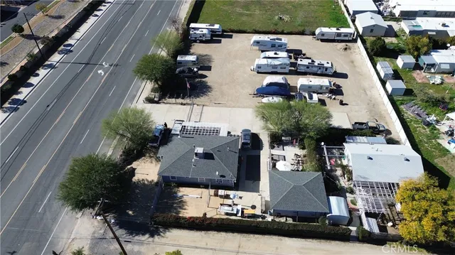 an aerial view of houses with outdoor space