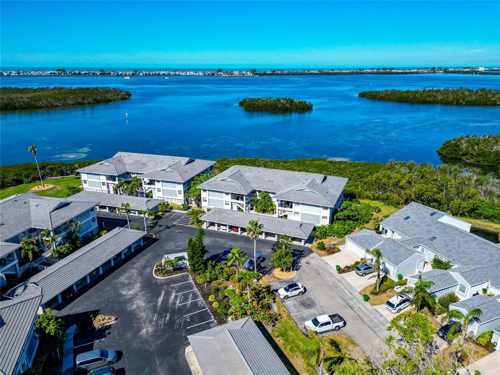1389 Perico Point Circle, Unit 140 Bradenton, FL 34209 - Photo 1 of 58 an aerial view of ocean and houses with outdoor space