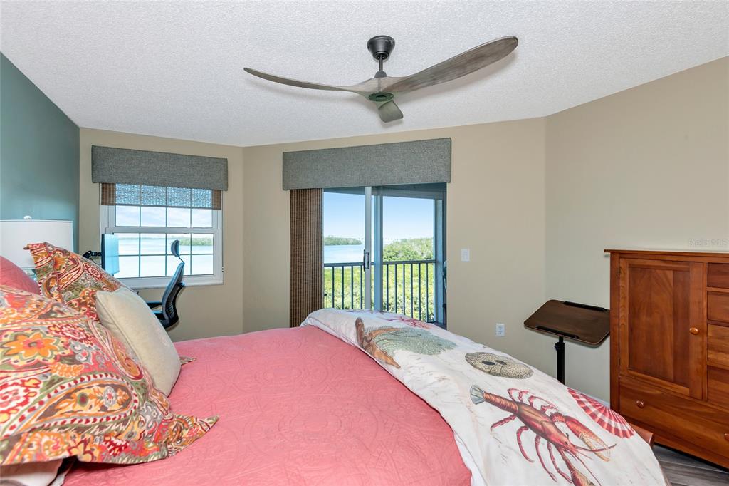 1389 Perico Point Circle, Unit 140 Bradenton, FL 34209 - Photo 32 of 58 a bedroom with a bed and a large window