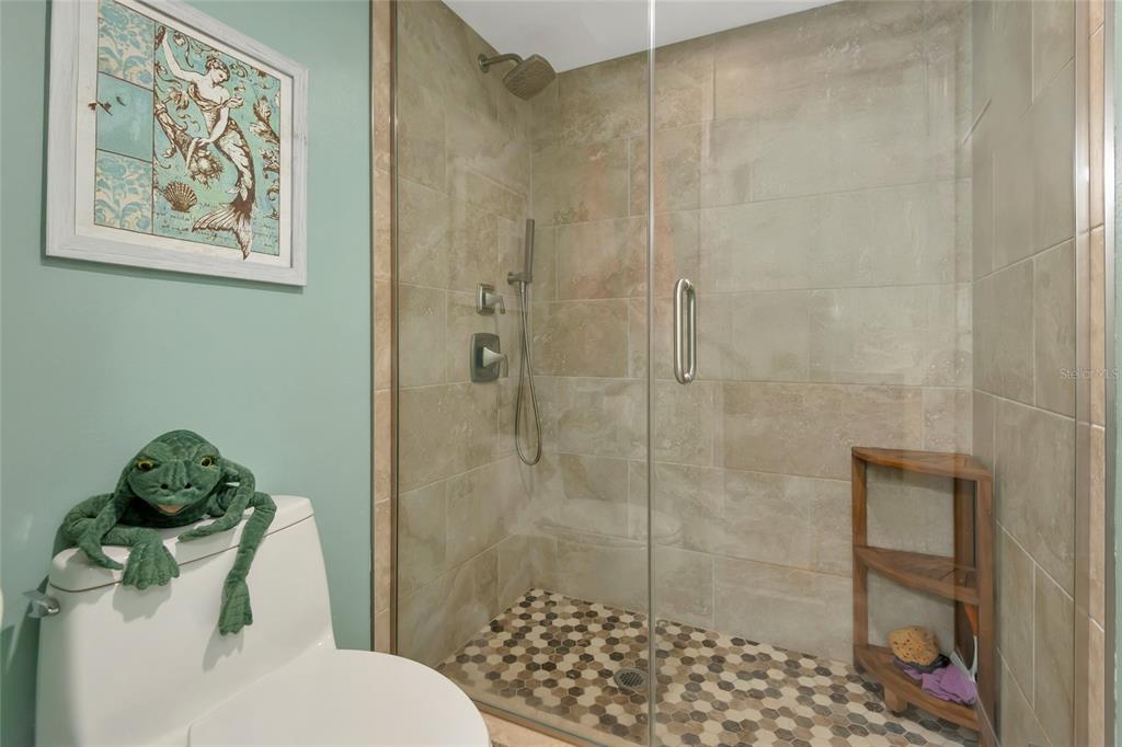 1389 Perico Point Circle, Unit 140 Bradenton, FL 34209 - Photo 35 of 58 a bathroom with a toilet and a shower