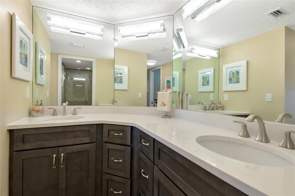 1389 Perico Point Circle, Unit 140 Bradenton, FL 34209 - Photo 36 of 58 a bathroom with a sink and a mirror