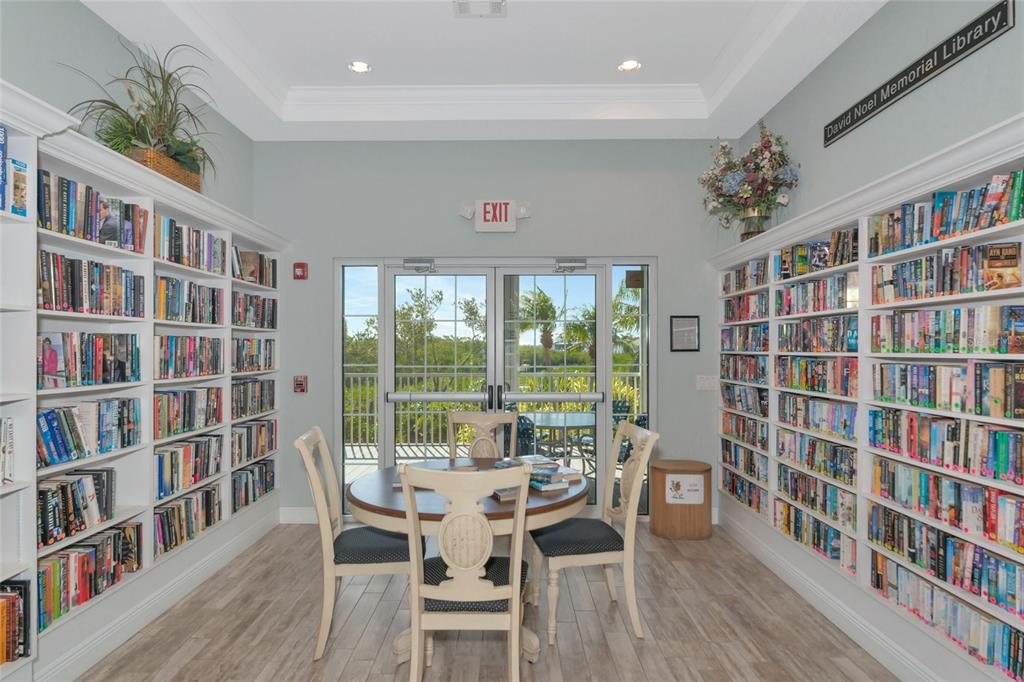 1389 Perico Point Circle, Unit 140 Bradenton, FL 34209 - Photo 44 of 58 a dining room with furniture window and wooden floor