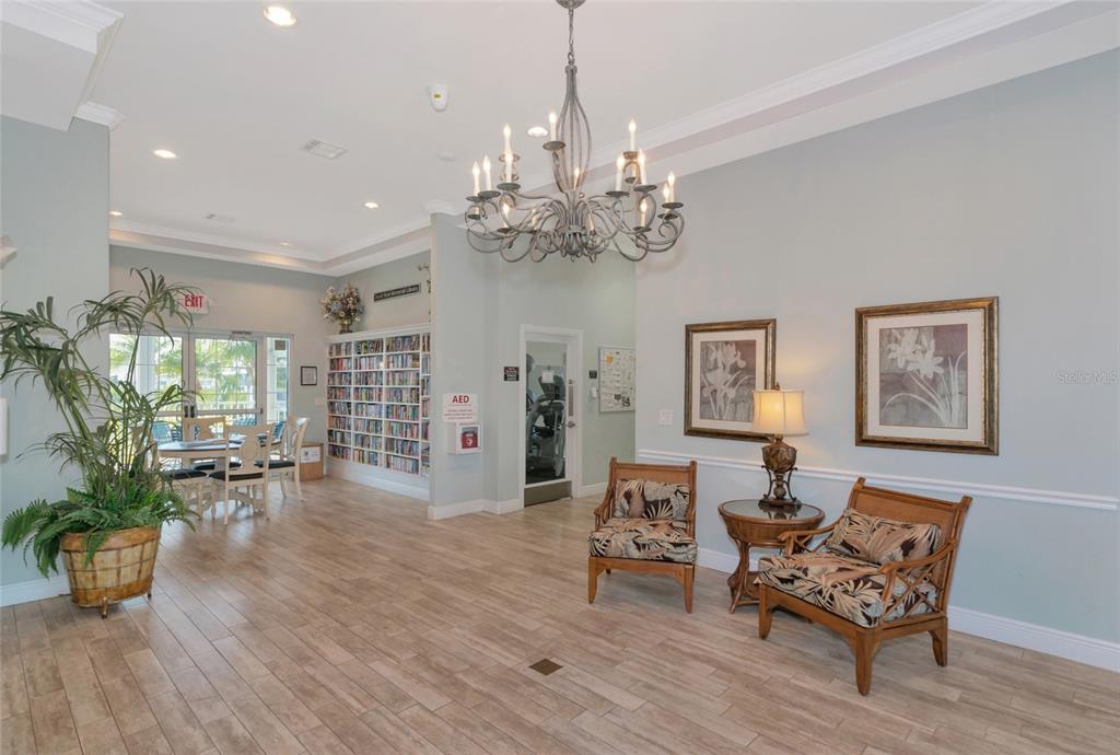 1389 Perico Point Circle, Unit 140 Bradenton, FL 34209 - Photo 45 of 58 a living room with furniture chandelier and wooden floor