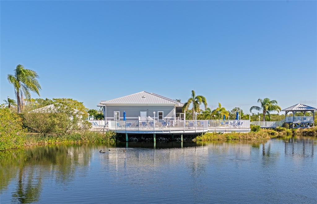 1389 Perico Point Circle, Unit 140 Bradenton, FL 34209 - Photo 49 of 58 a view of a lake with house