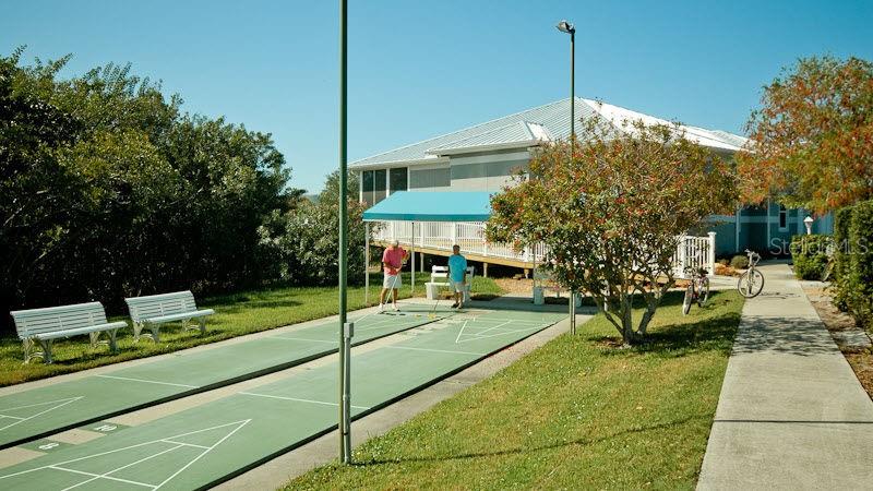 1389 Perico Point Circle, Unit 140 Bradenton, FL 34209 - Photo 55 of 58 a view of a house with sitting area and garden