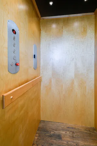 a kitchen with stainless steel appliances a stove and white cabinets