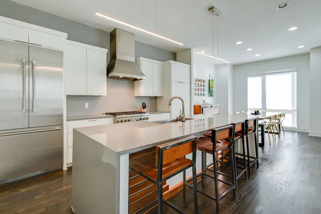 a kitchen with a stove and a refrigerator