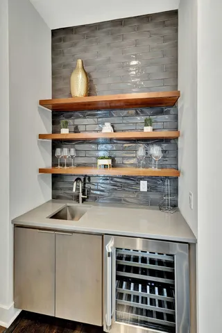 a en suite bathroom with a double vanity sink and a mirror