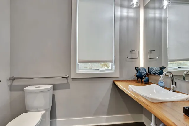 a bathroom with a glass shower door