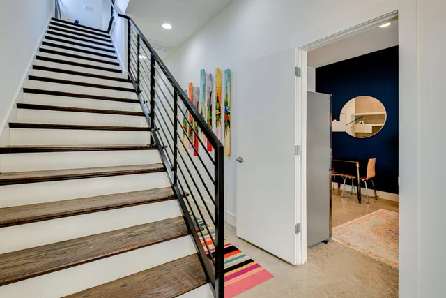 a bedroom with a bed and a chair