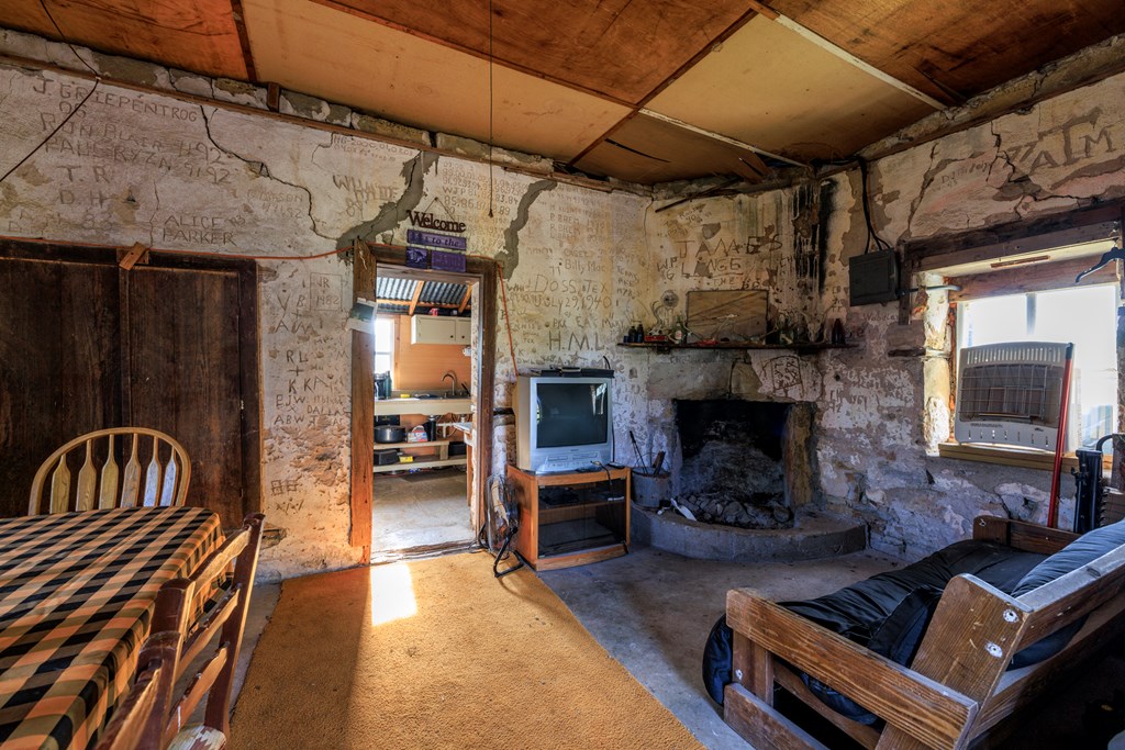 2937 Langes Mill Road Doss, TX 78618 - Photo 27 of 68 a living room with furniture and a fireplace
