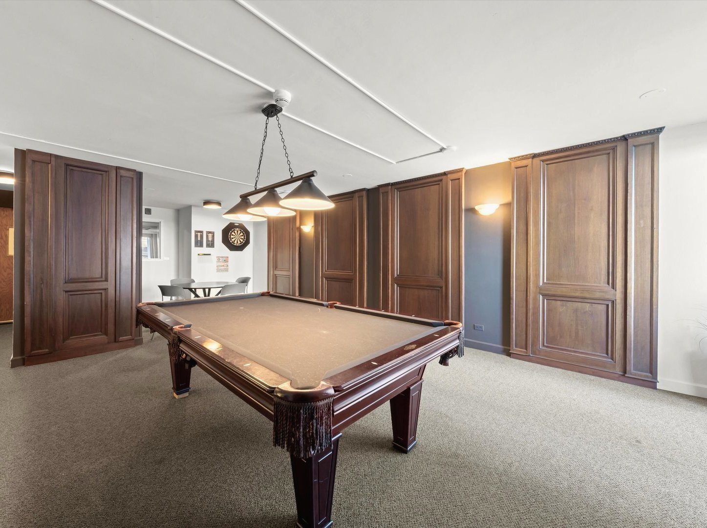 6033 North Sheridan Road, Unit 9E Chicago, IL 60660 - Photo 17 of 23 a room with pool table and windows