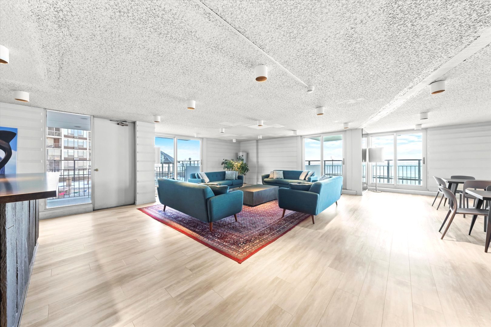 6033 North Sheridan Road, Unit 9E Chicago, IL 60660 - Photo 20 of 23 a living room with furniture and a wooden floor