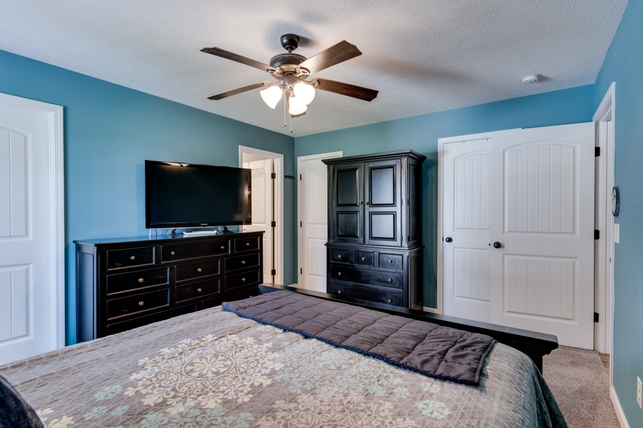 7927 Cedar Grove Road Cross Plains, TN 37049 - Photo 21 of 26 a bedroom with a bed and a flat screen tv