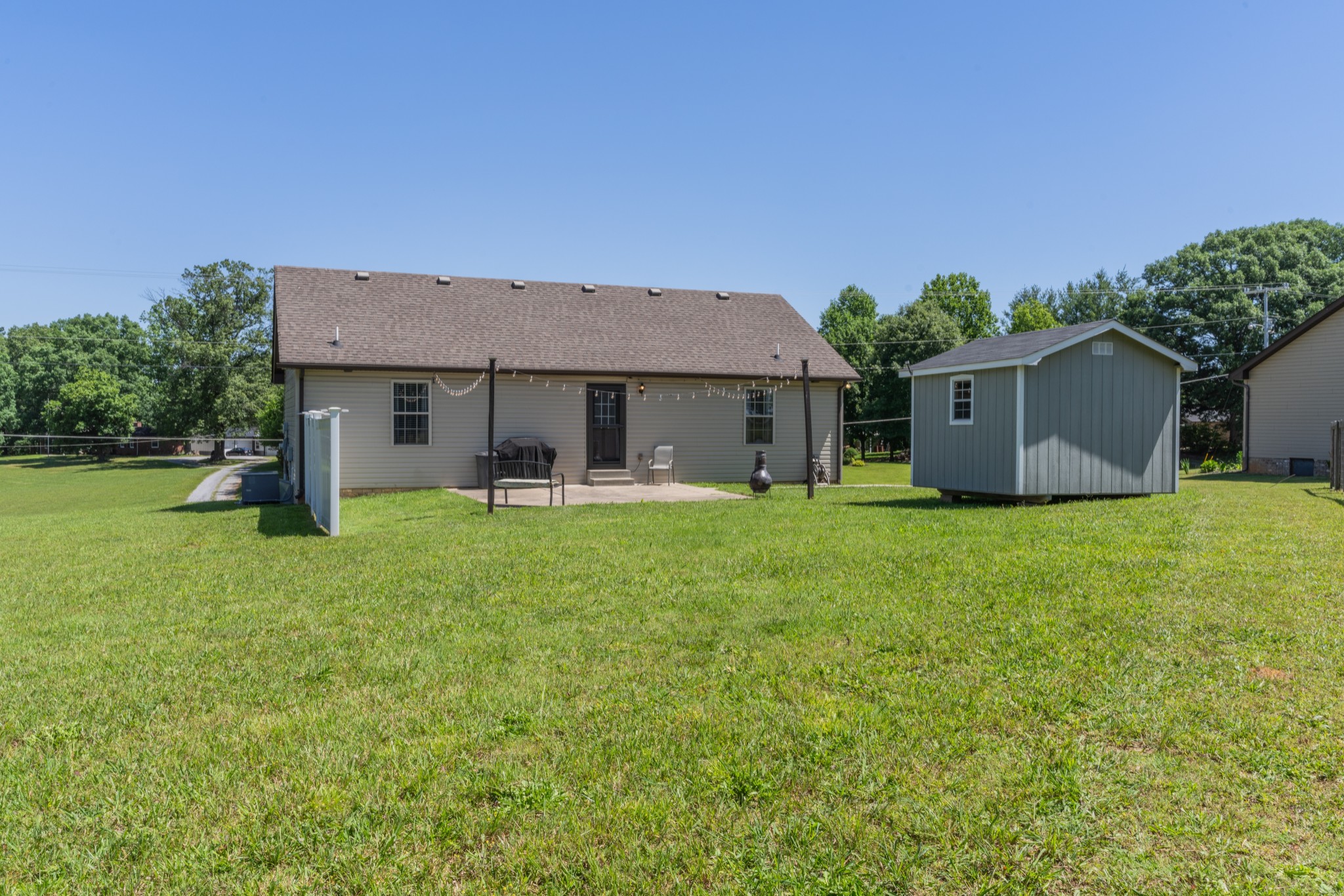 7927 Cedar Grove Road Cross Plains, TN 37049 - Photo 24 of 26 a backyard of a house with table and chairs