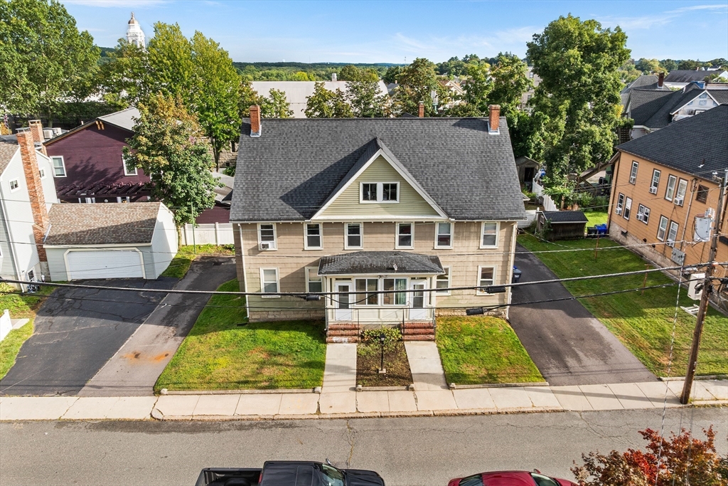 4 State Street, Unit 4 Milford, MA 01757 - Photo 1 of 23 front view of house with a yard