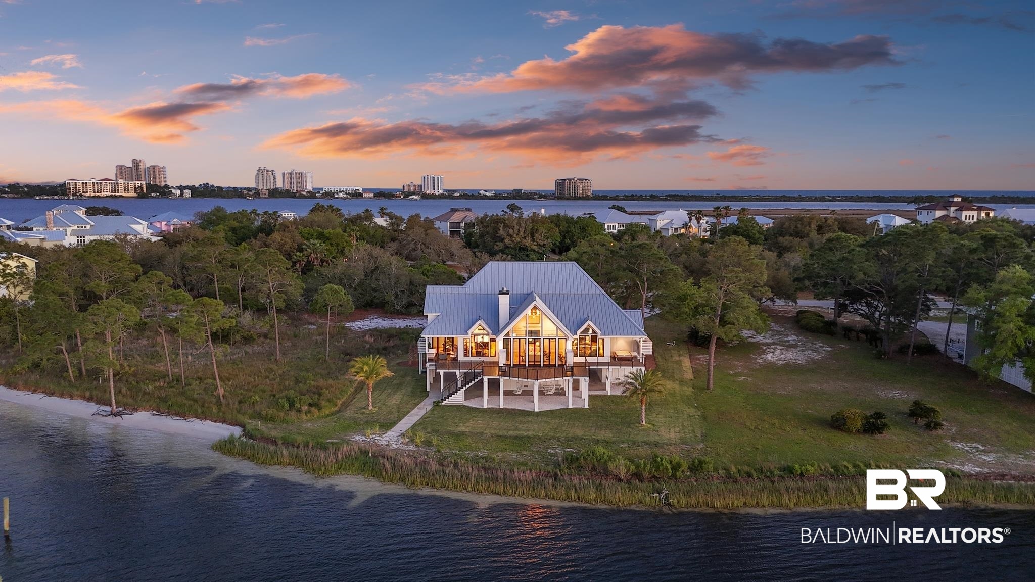 33349 River Road Orange Beach, AL 36561 - Photo 56 of 61 Waterfront residence featuring a light-colored exterior with a metal roof