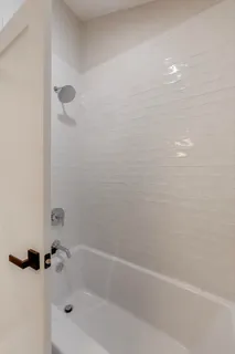 a view of a kitchen with a sink and a refrigerator