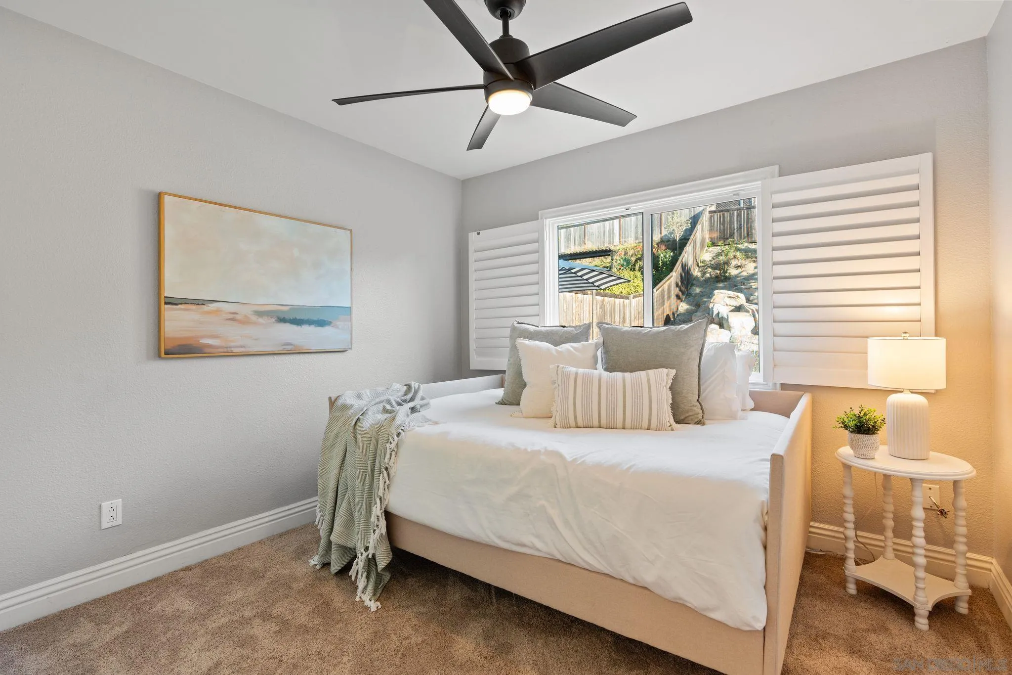 3576 Normandy Circle Oceanside, CA 92056 - Photo 32 of 67 a bedroom with a bed and a window