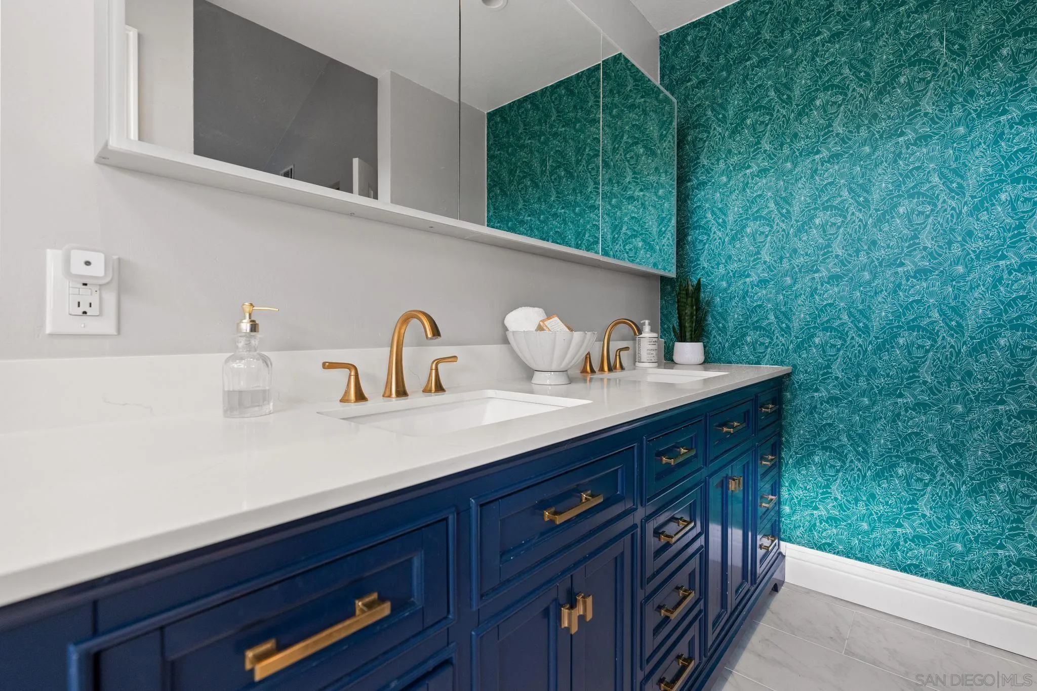 3576 Normandy Circle Oceanside, CA 92056 - Photo 39 of 67 a kitchen with a sink cabinets and wooden floor