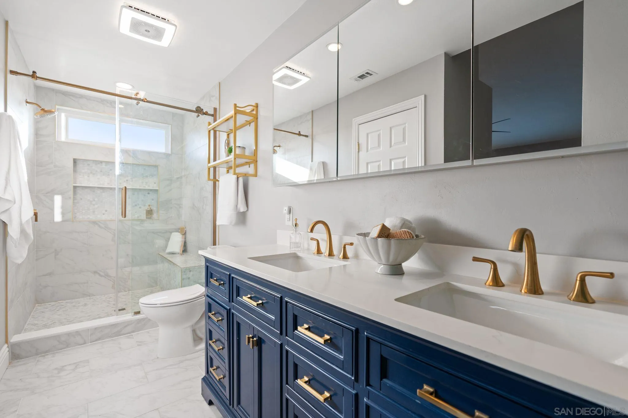 3576 Normandy Circle Oceanside, CA 92056 - Photo 41 of 67 a bathroom with a sink a toilet and shower