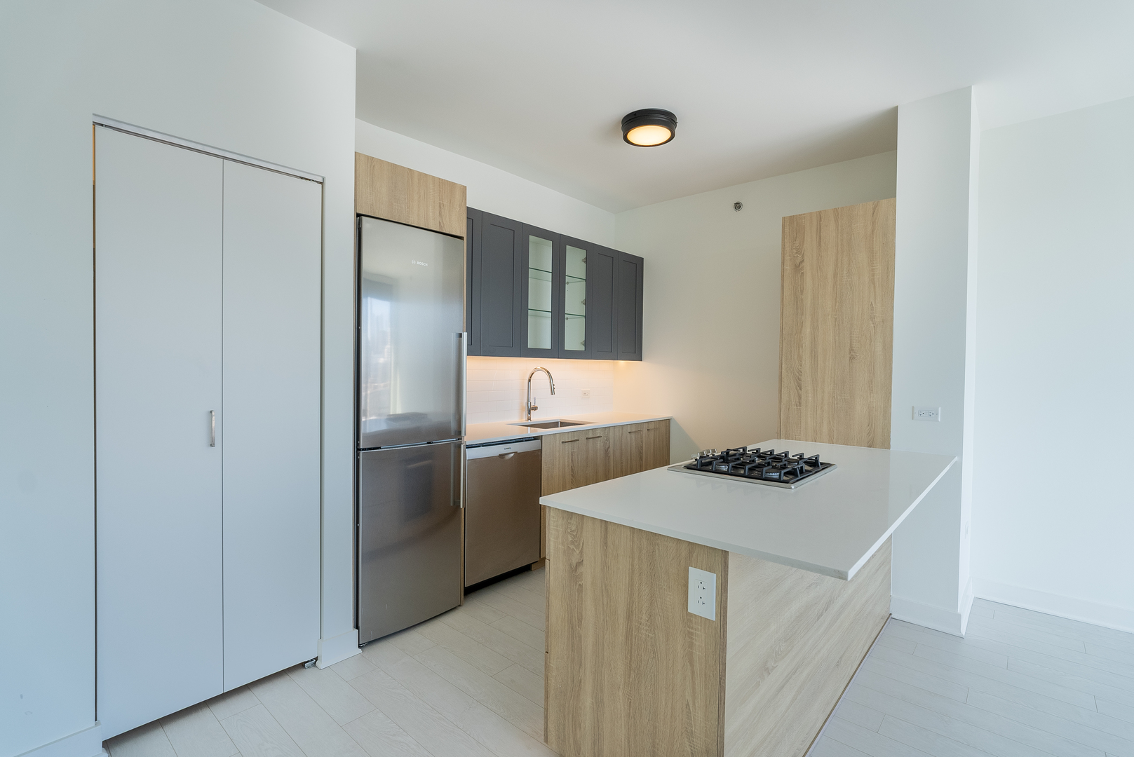 1035 West Van Buren Street, Unit 1900 Chicago, IL 60607 - Photo 4 of 12 a kitchen with a refrigerator and a stove