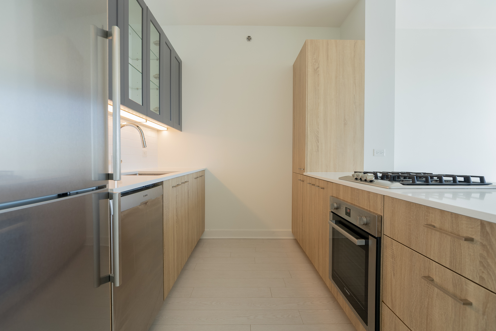 1035 West Van Buren Street, Unit 1900 Chicago, IL 60607 - Photo 5 of 12 a bathroom with a sink and a mirror