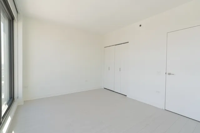 a bathroom with a toilet a sink and shower