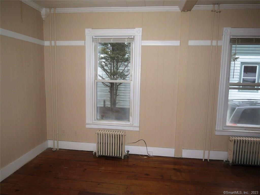 13 Wilcox Street Wethersfield, CT 06109 - Photo 11 of 21 a view of empty room with wooden floor and fan