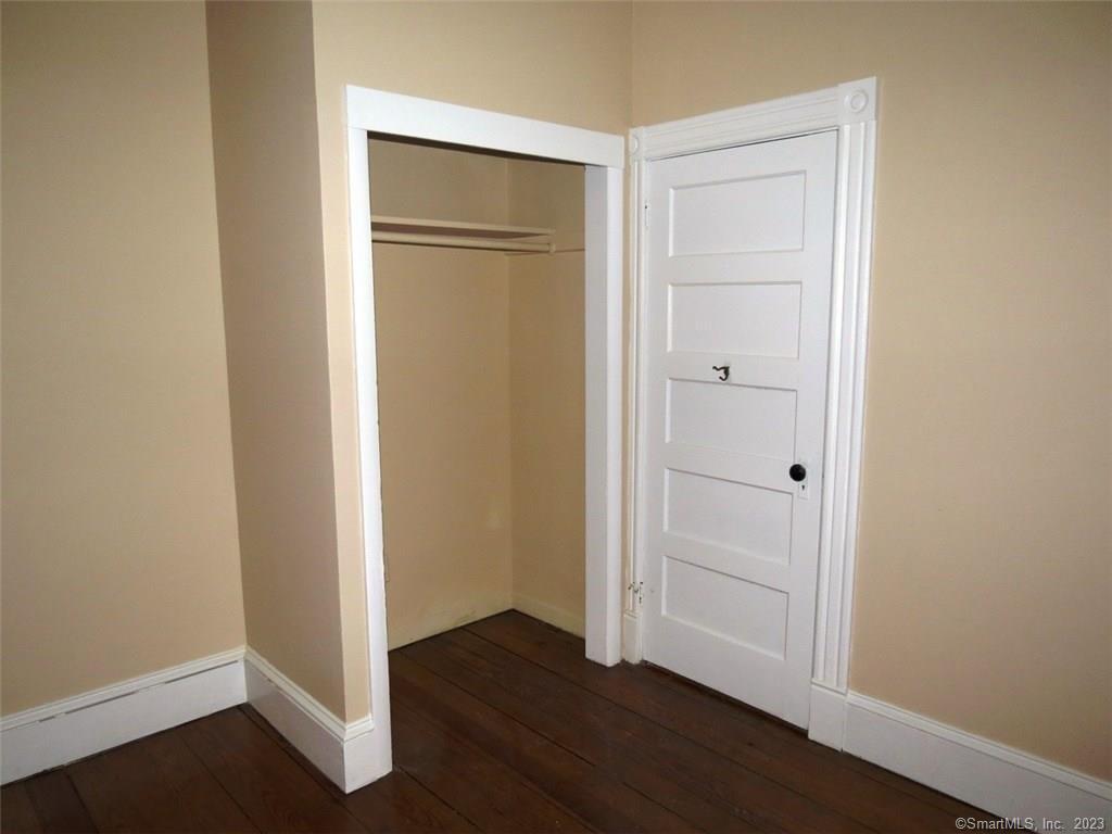13 Wilcox Street Wethersfield, CT 06109 - Photo 15 of 21 an empty room with wooden floor & closet area