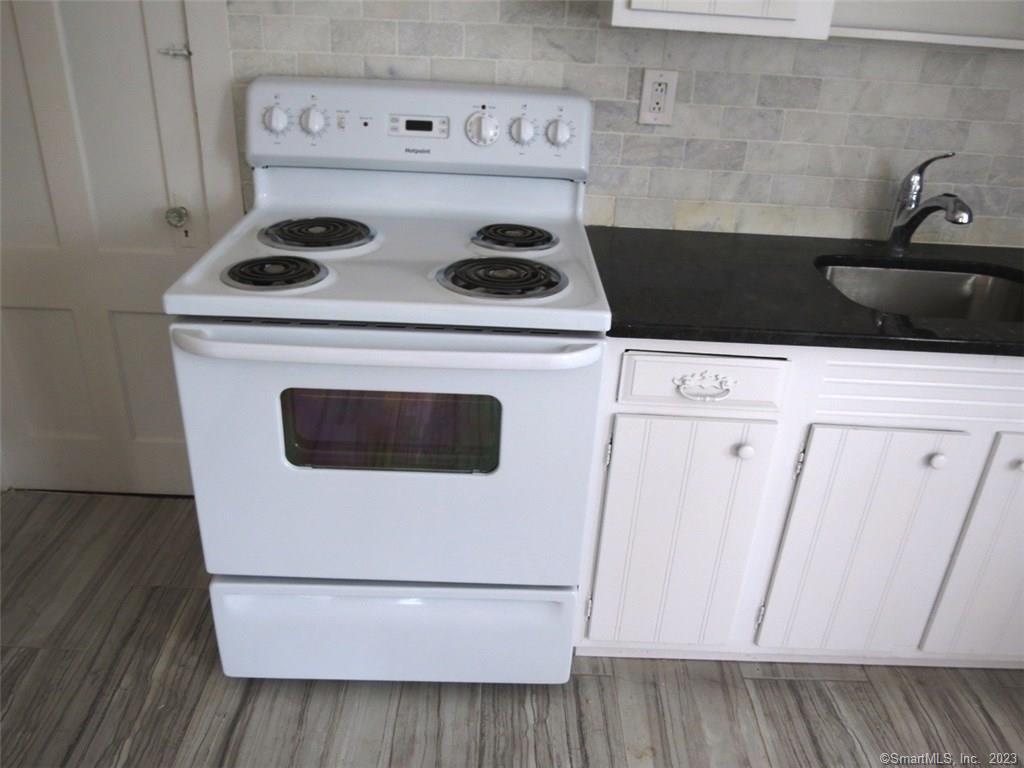 13 Wilcox Street Wethersfield, CT 06109 - Photo 17 of 21 a utility room with dryer and washer